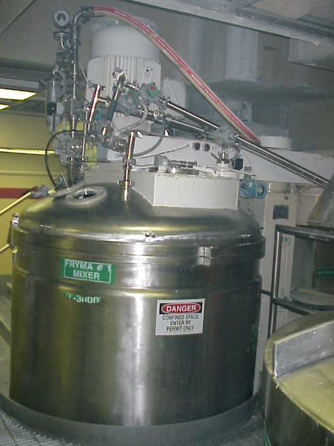 ***SOLD*** used 2400 liter Fryma VME-2400 Vacuum Processing Vessel/Kettle, Dual Shaft, Sanitary construction, 2400 Liter (630 Gallon) working capacity. There are two agitator drives. A 7.5 hp motor drives a center 3 blade counter rotating agitator and a scrape agitator through a chain drive. A 50 hp motor drives a disperser type agitator off to the side of the center shaft. Working temperatures are 150 Deg.C (302 Deg.F.)for the interior and the jacket. The interior has a pressure rating of -1/+1 bar and the jacket has a 2.5 bar rating. The top has an 8
